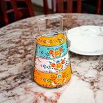 Hand-painted stainless steel tiffin carrier combines durability with artistic charm, making it a thoughtful gift for family or friends